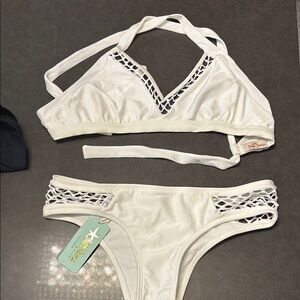 Luli Fama White Bikini Net Accents. Halter style tie in back top L Bottom small